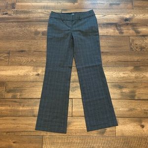 Grey patterned trousers.